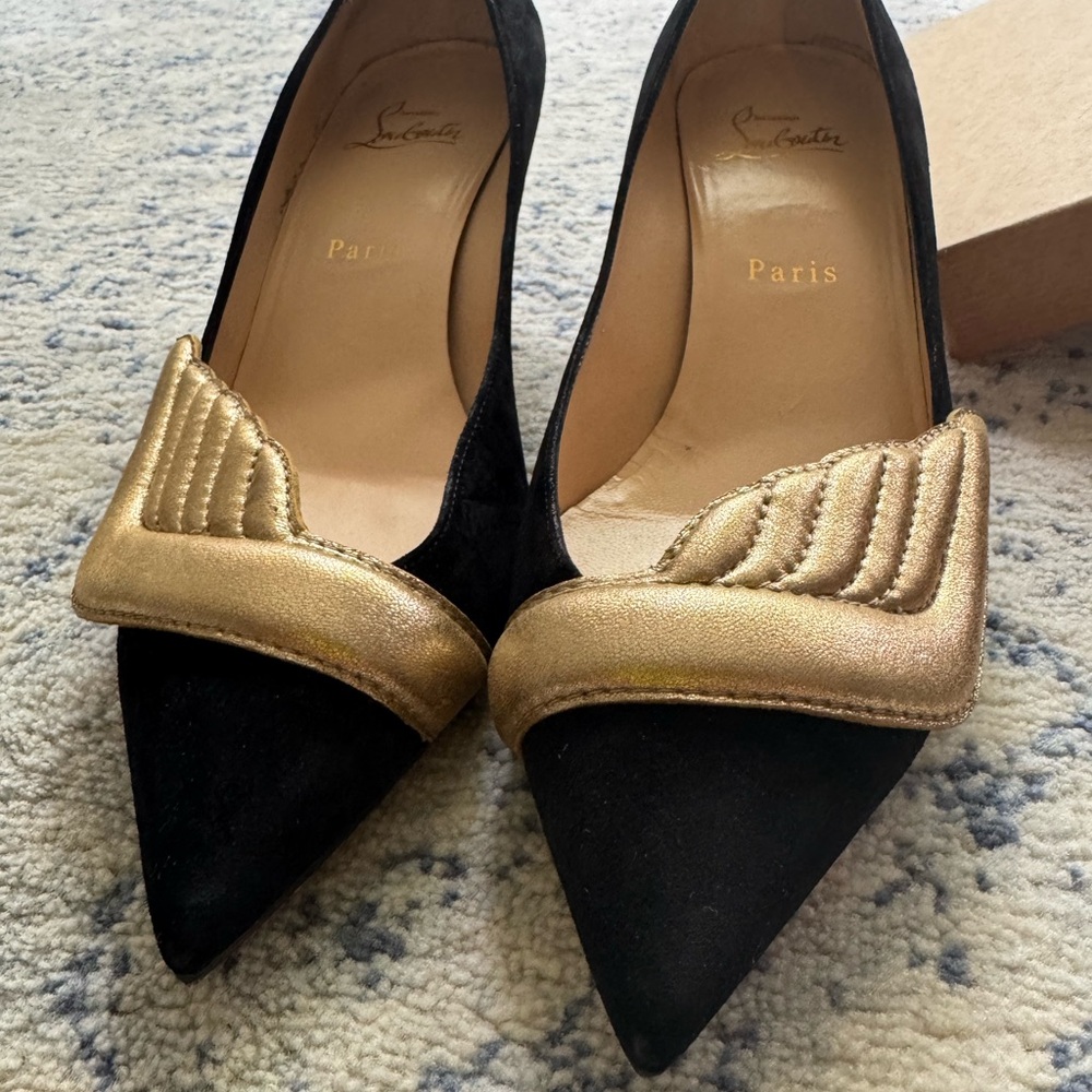 Christian Louboutin Black and Gold Heels. Worn once. Sole protectors in.